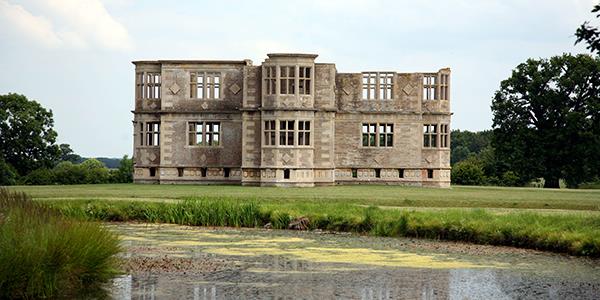 A panoramic vieew of Lyveden New Bield summer house and its surrounding parkland