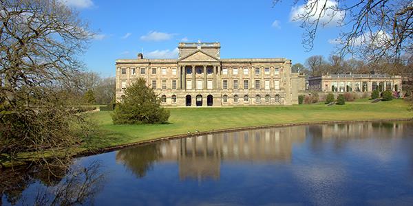 A panoramic view of Lyme Park stately home and surrounding parkland